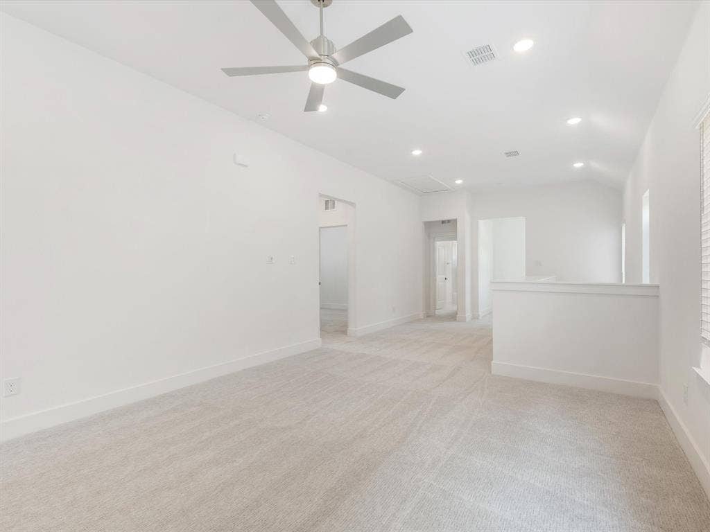 Large gameroom featuring light carpet, recessed lighting, and ceiling fan