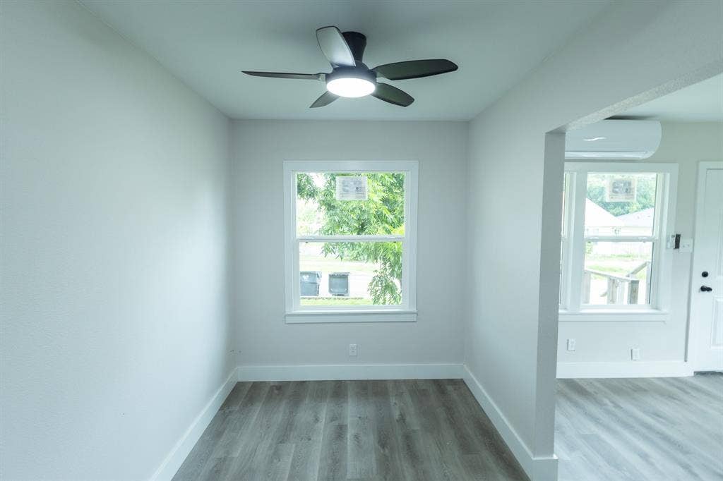 1716 Ethel Avenue, #1714, 1718, 1720, Waco, TX 76707 Recessed lighting, wood-finish flooring, ceiling fan, white trim, and a window unit