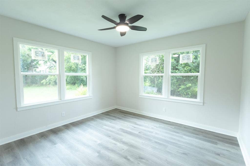 1716 Ethel Avenue, #1714, 1718, 1720, Waco, TX 76707 Light gray walls complement the wood-finish flooring