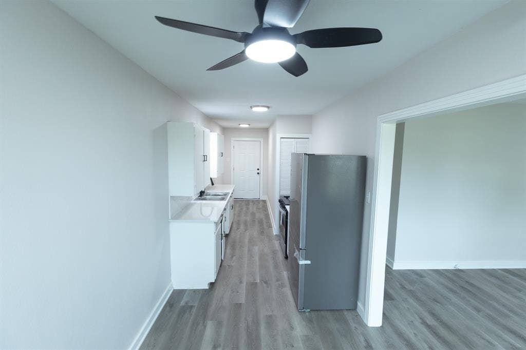 1716 Ethel Avenue, #1714, 1718, 1720, Waco, TX 76707 Kitchen featuring a ceiling fan with integrated lighting, recessed lighting, white cabinetry, integrated sink, and stainless steel appliances