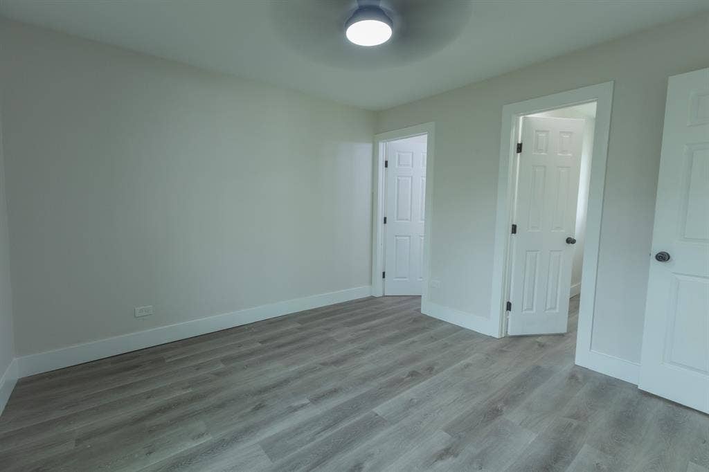 1716 Ethel Avenue, #1714, 1718, 1720, Waco, TX 76707 Light wood-finish flooring, white walls, and a ceiling-mounted light fixture