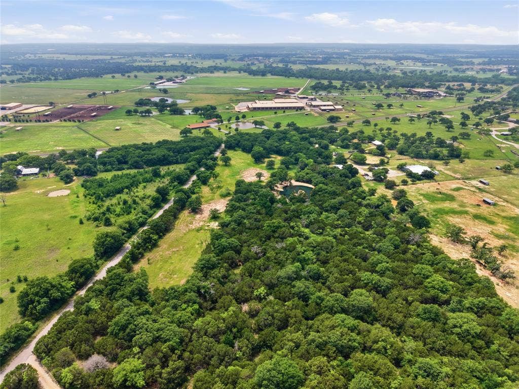 TBD Manley Road, Weatherford, TX 76088 Expansive rural landscape featuring lush green fields and dense tree coverage