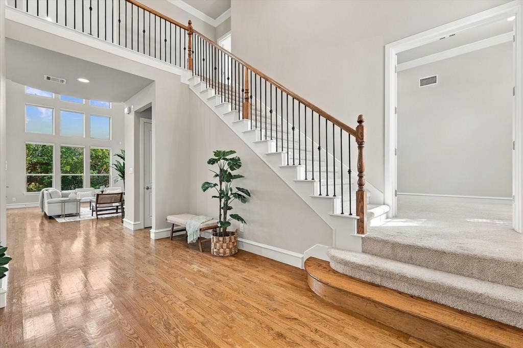6200 Corsica Way, Plano, TX 75024 Beautiful entry with wood floors and rod iron staircase