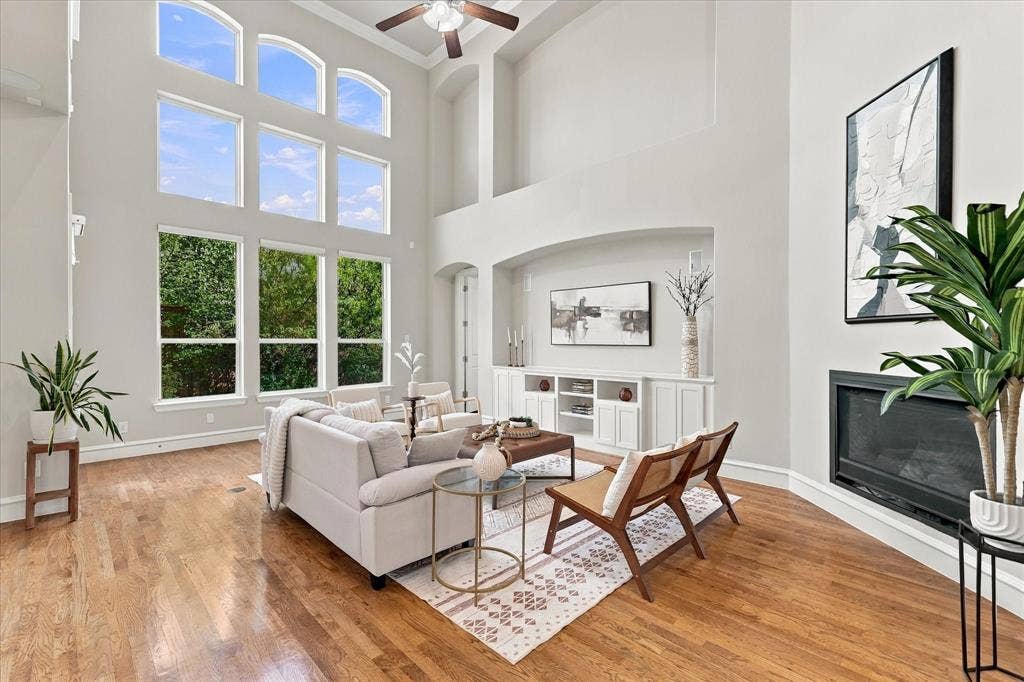 6200 Corsica Way, Plano, TX 75024 Living Room with vaulted ceilings and wall of windows providing ample natural light. LED ceiling lights installed, removes the need to change bulbs
