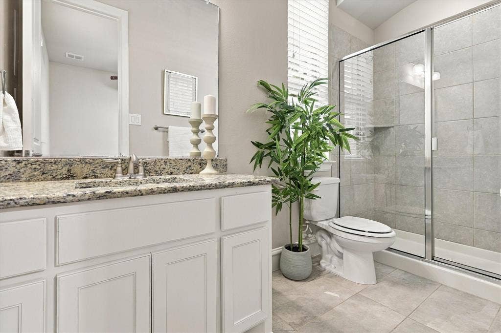 6200 Corsica Way, Plano, TX 75024 First floor guest bathroom with walk-in shower and granite counters