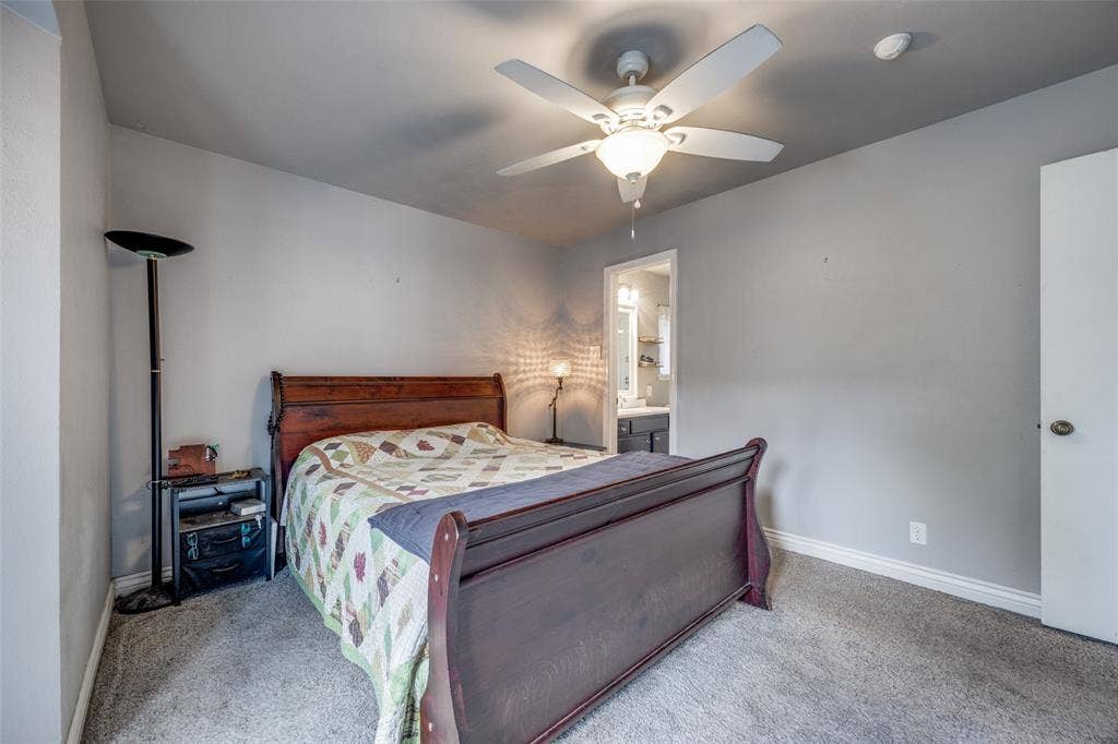 6401 Stonewall Street, Greenville, TX 75402 Carpeted flooring, ceiling fan with integrated lighting, and neutral wall tones