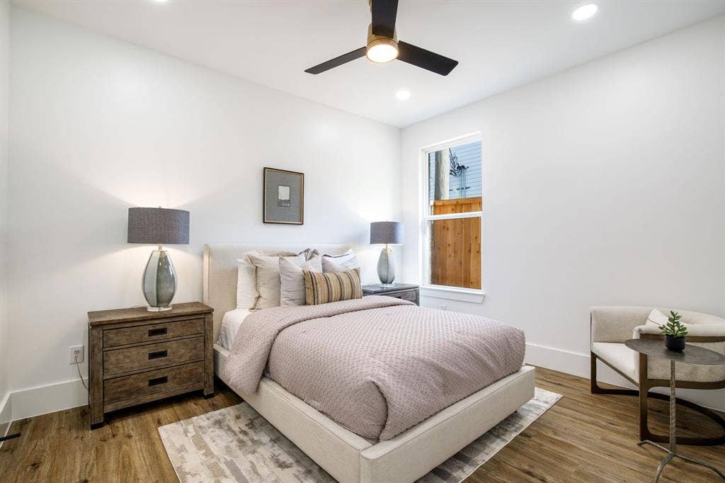 Recessed lighting, wood-finish flooring, and a ceiling fan with light fixture