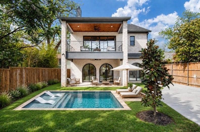 Expansive backyard big enough for a pool. This picture is a rendering of what a pool could look like. There is no pool currently on the property.