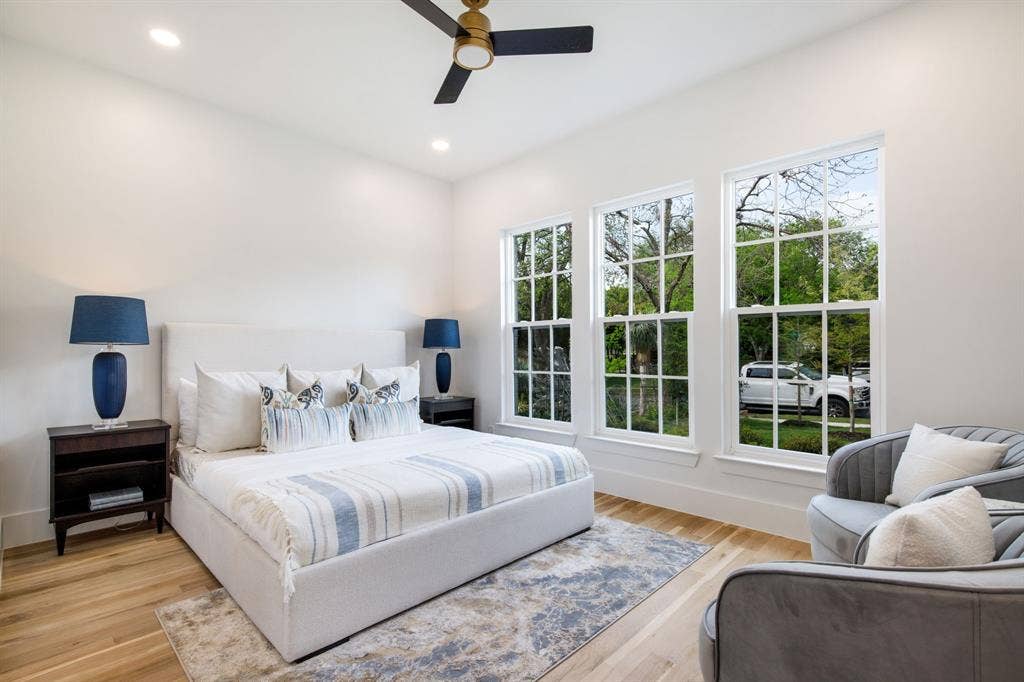 Hardwood flooring, recessed lighting, and a ceiling fan