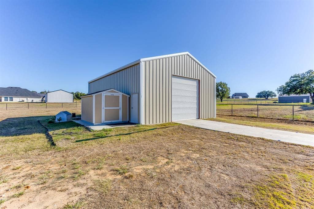 Workshop has overhead doors on both ends