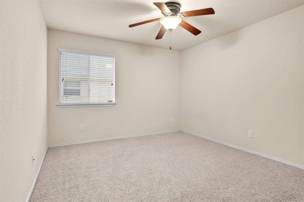 10108 Parker Springs Drive, Waco, TX 76708 Neutral-toned carpeting paired with light walls