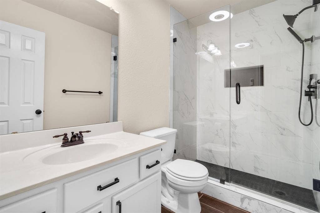 10108 Parker Springs Drive, Waco, TX 76708 White vanity with an integrated sink and bronze-finish faucet