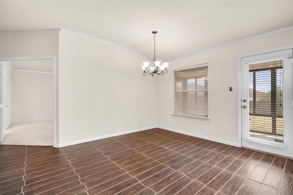 10108 Parker Springs Drive, Waco, TX 76708 Tile flooring, chandelier, window with blinds, and exterior door with integrated blinds