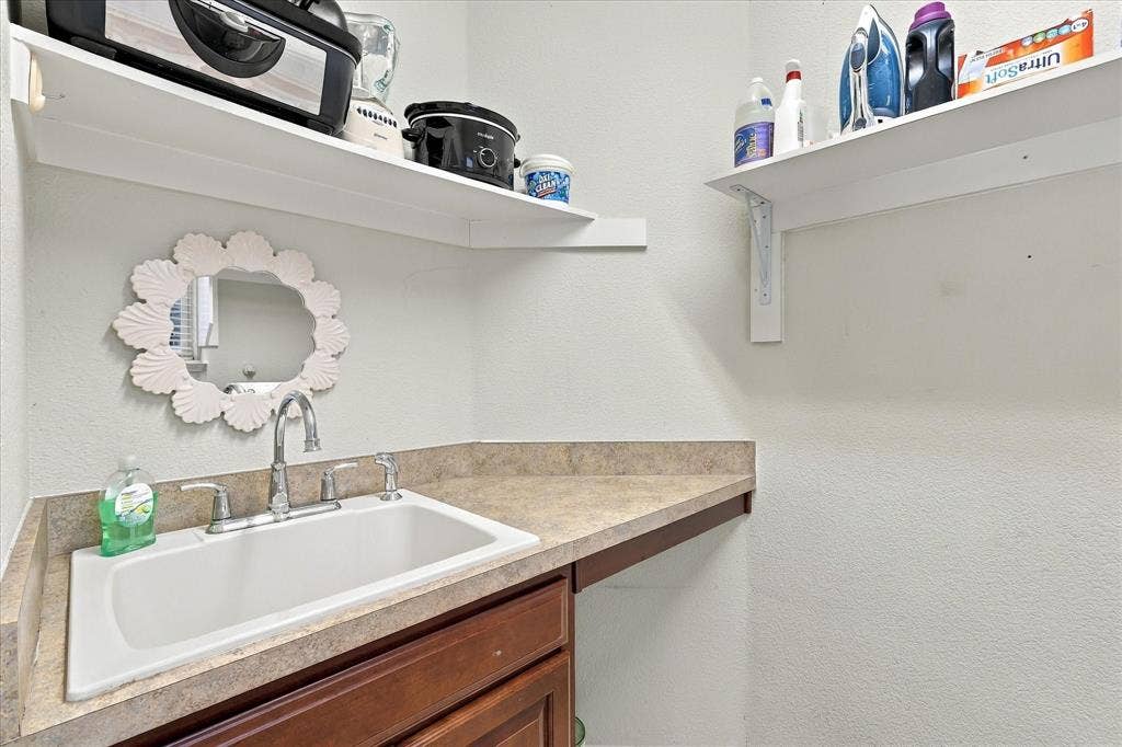 1118 Imperial Valley Lane, Frisco, TX 75036 Utility Room with a sink and built in cabinets