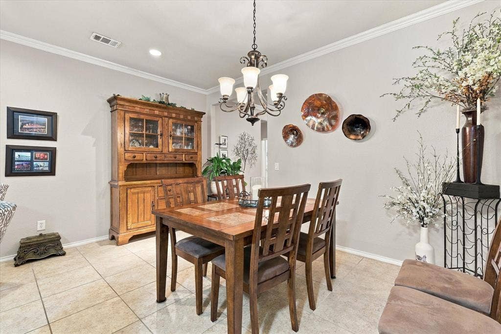 1118 Imperial Valley Lane, Frisco, TX 75036 Dining area featuring tile flooring, crown molding, a multi-light chandelier, and recessed lighting