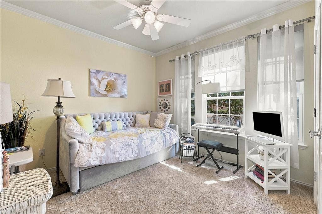 1118 Imperial Valley Lane, Frisco, TX 75036 Plush carpet flooring, crown molding, ceiling fan, and large windows with sheer coverings