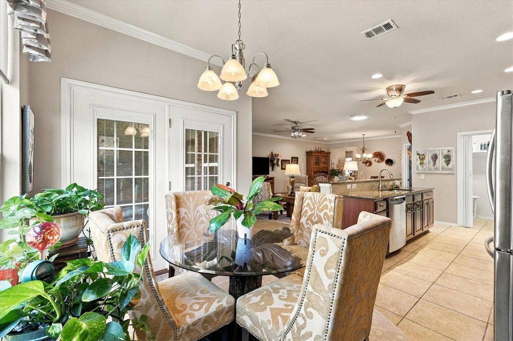 1118 Imperial Valley Lane, Frisco, TX 75036 French doors with divided lites, recessed lighting, crown molding, tile flooring, and a ceiling fan