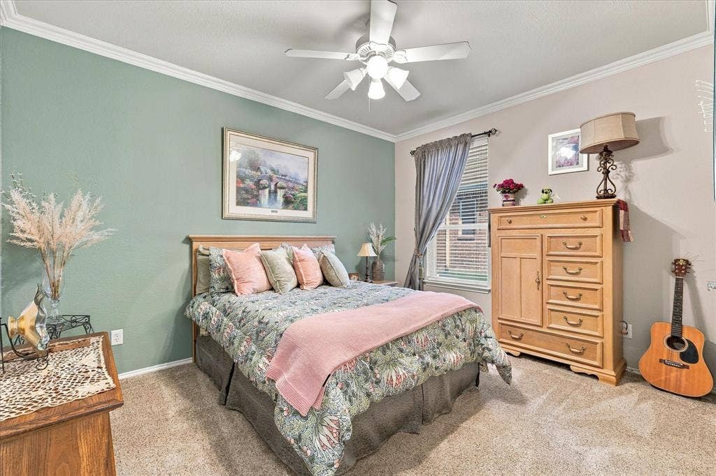 1118 Imperial Valley Lane, Frisco, TX 75036 Crown molding, textured carpeting, ceiling fan, and a window with blinds