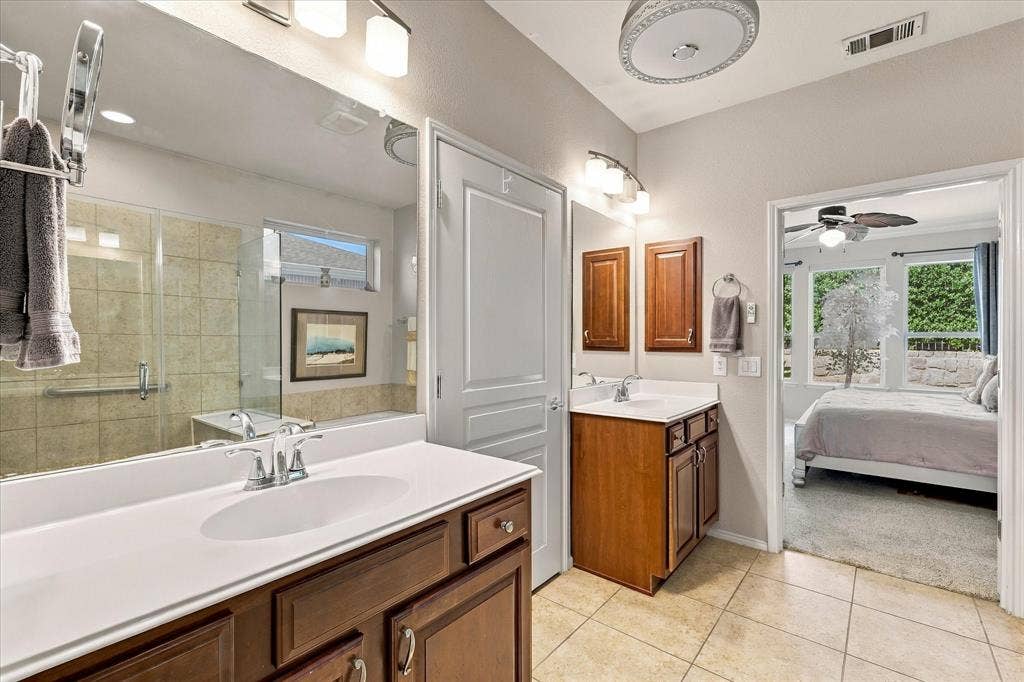 1118 Imperial Valley Lane, Frisco, TX 75036 Primary Bathroom with double vanity with wood-finish cabinetry
