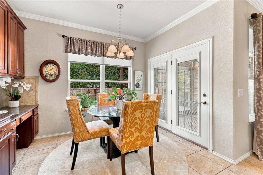 1118 Imperial Valley Lane, Frisco, TX 75036 Breakfast Area has a beautiful view of Landscaped Backyard and opens to Screened Patio
