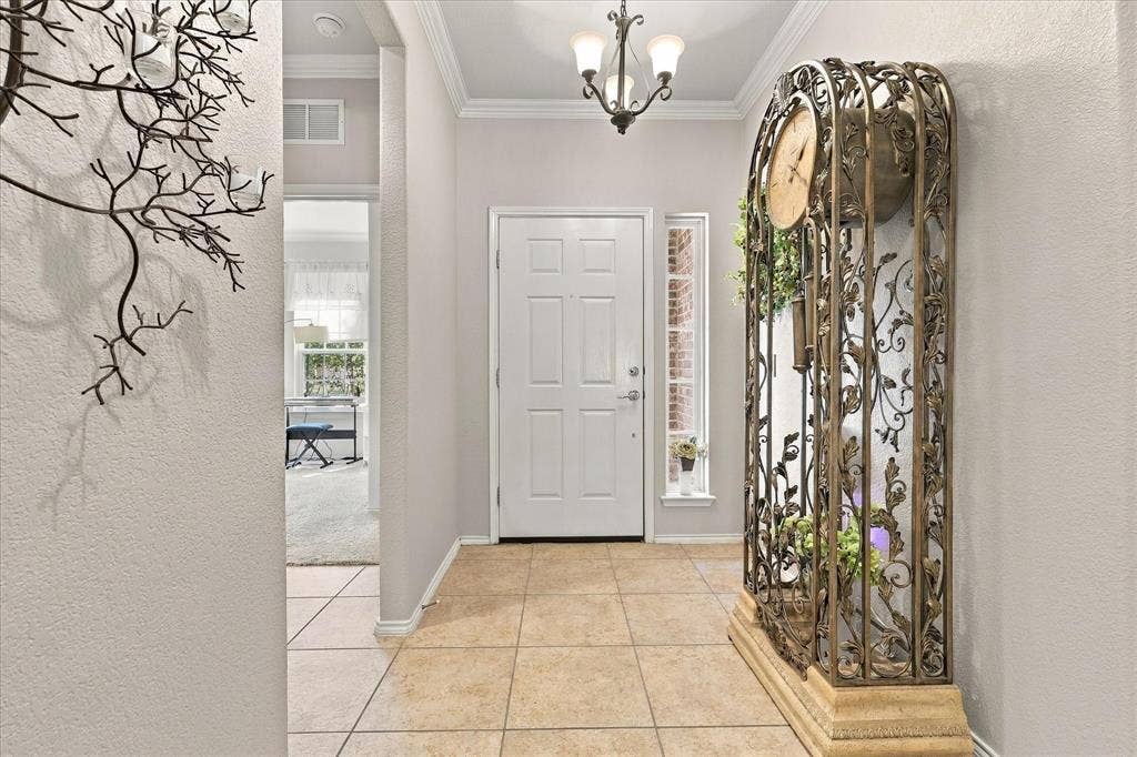 1118 Imperial Valley Lane, Frisco, TX 75036 Recessed entry with tile flooring, multi-panel entry door, and decorative transom window