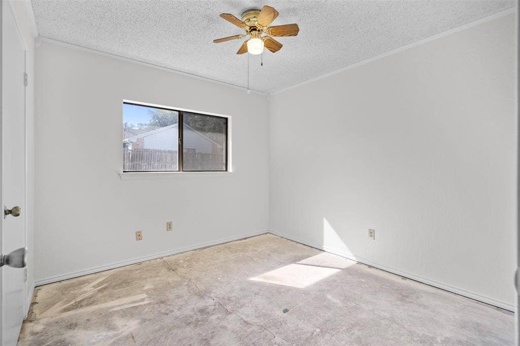 Interior room featuring white walls, a horizontal sliding window, and a ceiling fan with integrated lighting