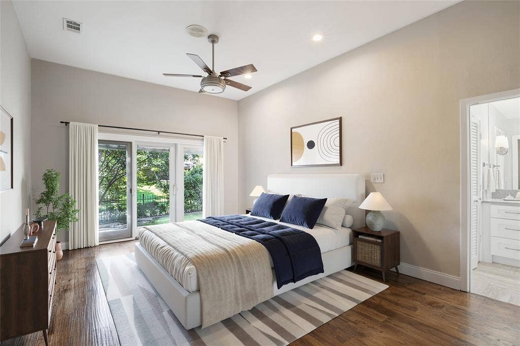 17411 Oakington Court, Dallas, TX 75252 The Primary Bedroom offers direct access to the backyard and lush views.