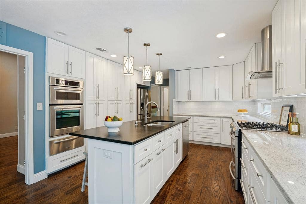 17411 Oakington Court, Dallas, TX 75252 Range with gas cooktop, additional wall oven, microwave, warming drawer, beverage refrigerator, etc!