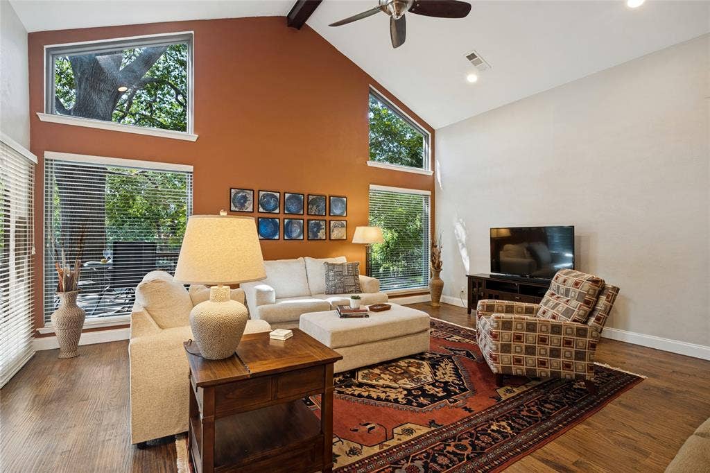 17411 Oakington Court, Dallas, TX 75252 Living Room has a vaulted beamed ceiling and dramatic windows bringing the outdoors in.