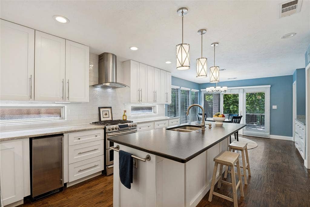 17411 Oakington Court, Dallas, TX 75252 Windowed backsplash is another clever way to bring in natural light!