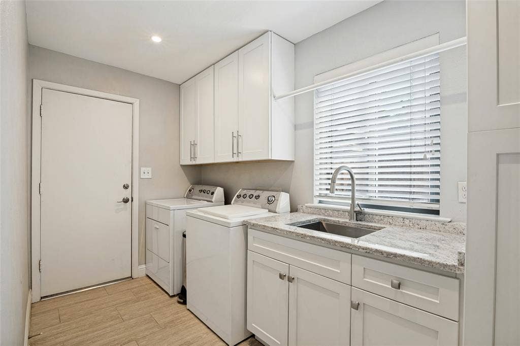 17411 Oakington Court, Dallas, TX 75252 Utility Room with window, sink, and lots of storage leads to the 2-car attached garage with epoxy floor.