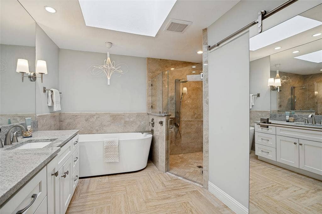 17411 Oakington Court, Dallas, TX 75252 View of the shower, plus the private commode room to the right with a mirrored rolling door for privacy.