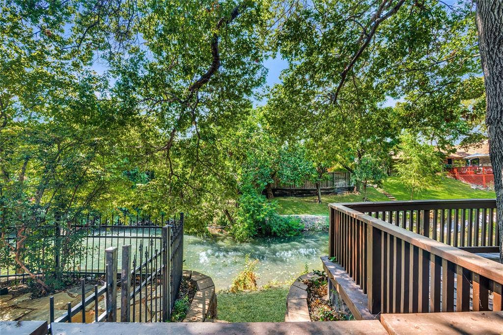 17411 Oakington Court, Dallas, TX 75252 Access the creek from deck and patio, and the views continue!