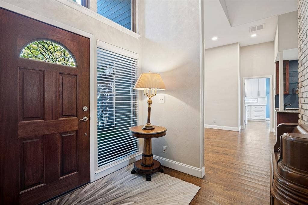 17411 Oakington Court, Dallas, TX 75252 Enter into an architecturally significant home with high ceilings and handsome wood floors.