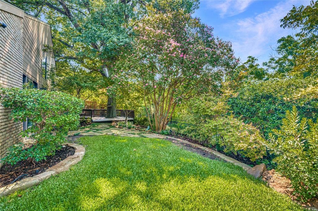 17411 Oakington Court, Dallas, TX 75252 Beyond the deck is a beautifully landscaped yard.