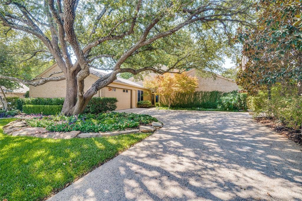 17411 Oakington Court, Dallas, TX 75252 Wide driveway to attached 2-car garage.
