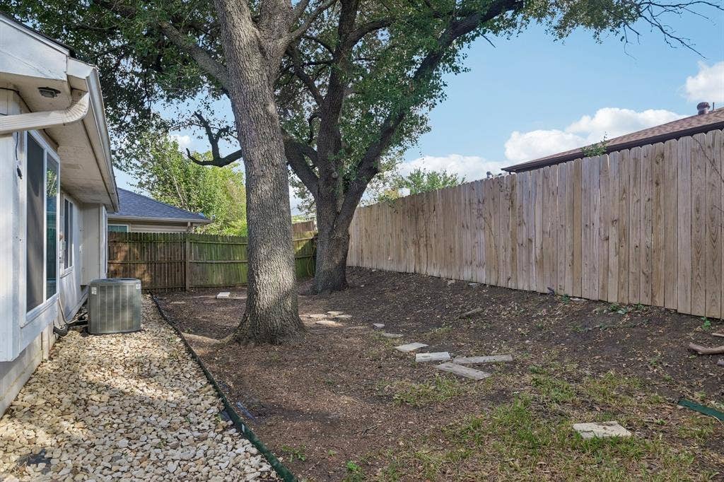 322 Valley Spring Drive, Arlington, TX 76018 Backyard has large shade trees