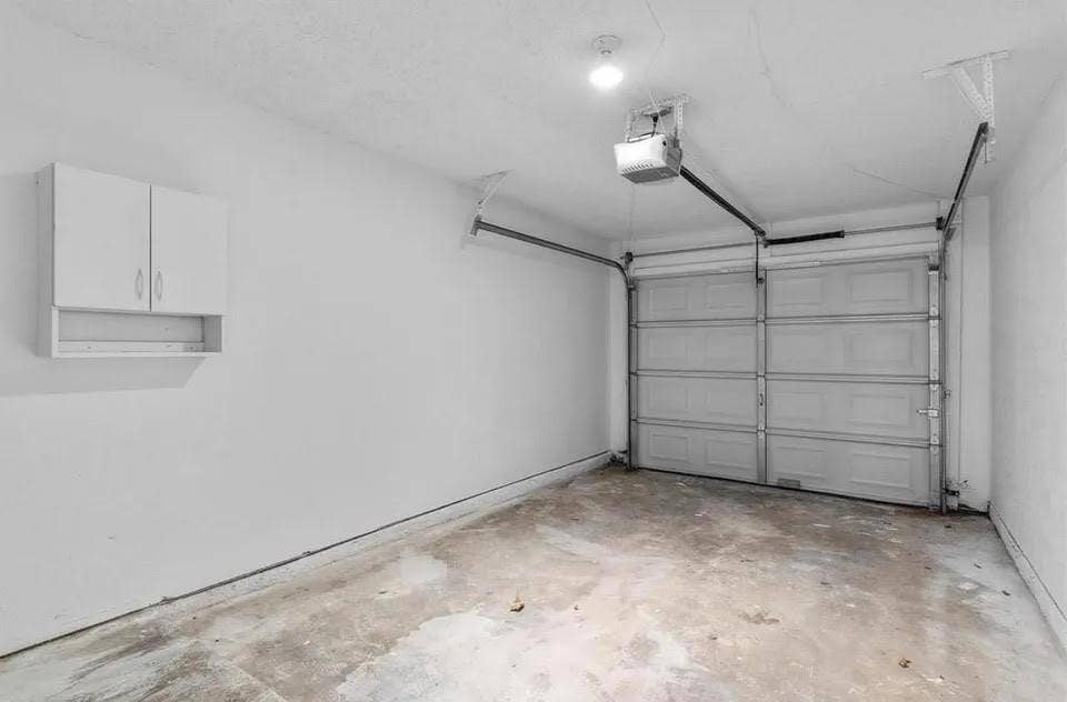 5326 Columbia Avenue, Dallas, TX 75214 A spacious garage with a hanging cabinet