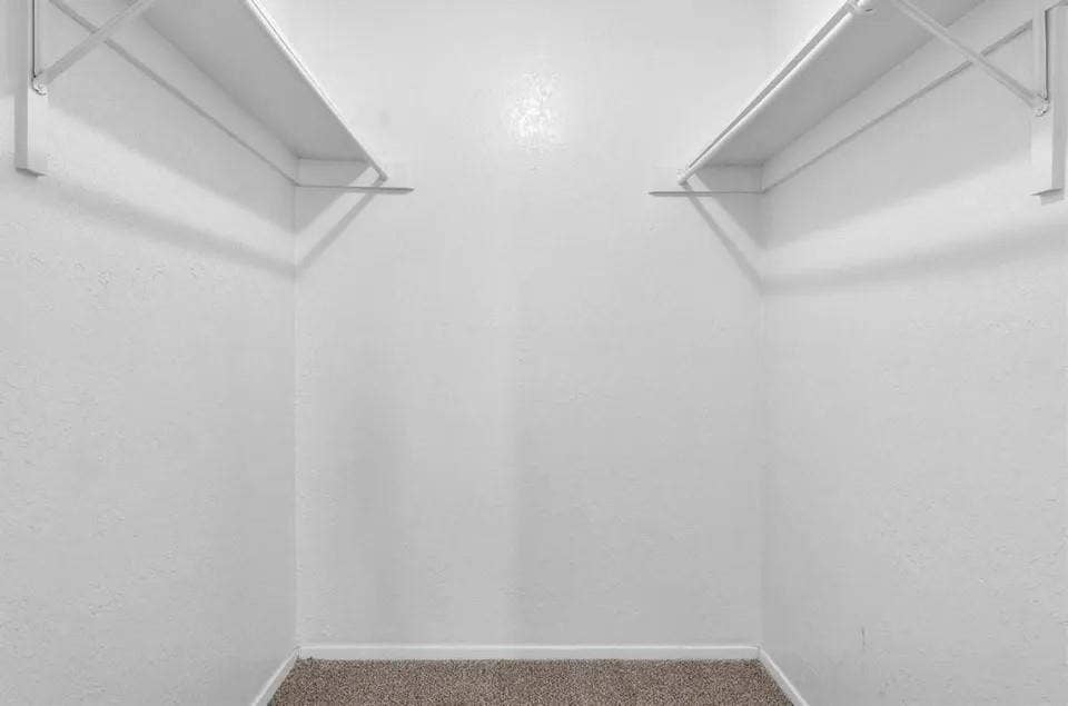 5326 Columbia Avenue, Dallas, TX 75214 A spacious, well-kit walk-in closet featuring parallel shelves