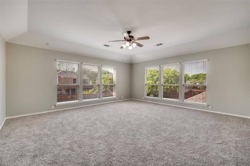 2873 Del Largo Way, Frisco, TX 75033 additional bonus roomor Media room featuring multiple windows, vaulted ceiling, and a ceiling fan with integrated lighting