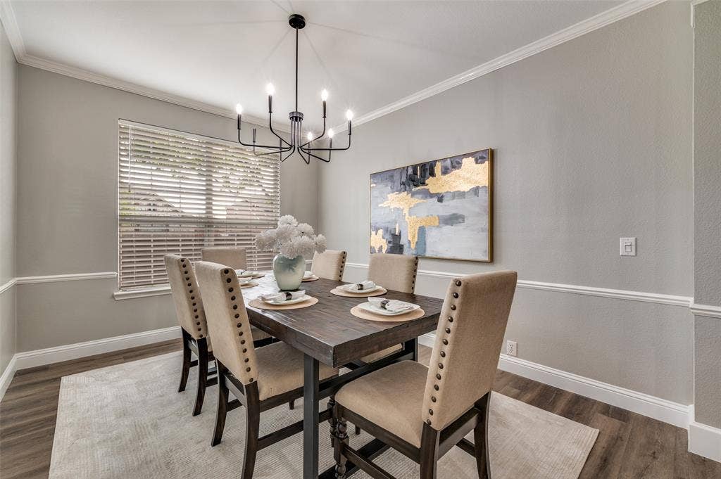 2873 Del Largo Way, Frisco, TX 75033 Wood-finish flooring with crisp white crown molding and chair rail detailing