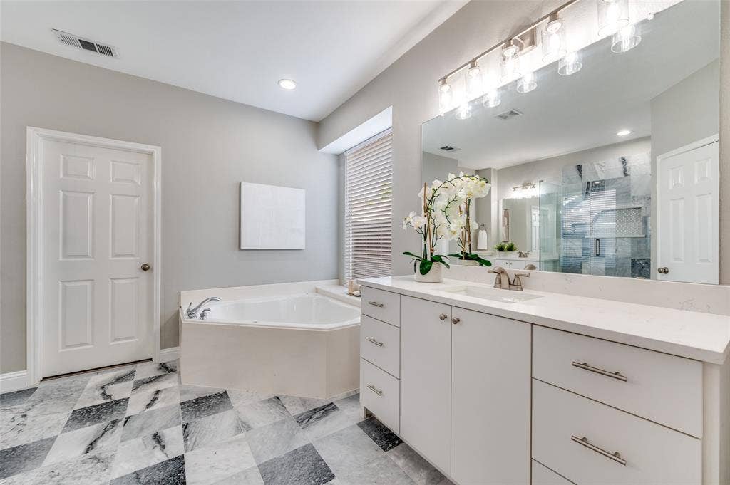 2873 Del Largo Way, Frisco, TX 75033 Dual vanity with white cabinetry and integrated sinks