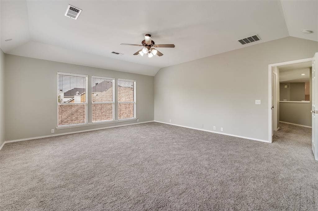 2873 Del Largo Way, Frisco, TX 75033 Gameroom with ceiling fan, three pane windows with blinds, light wall finish, and neutral carpet