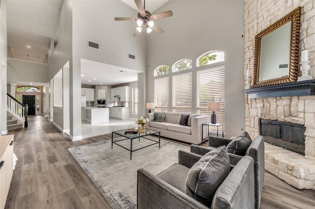 2873 Del Largo Way, Frisco, TX 75033 Two-story living area with high ceilings and a ceiling fan