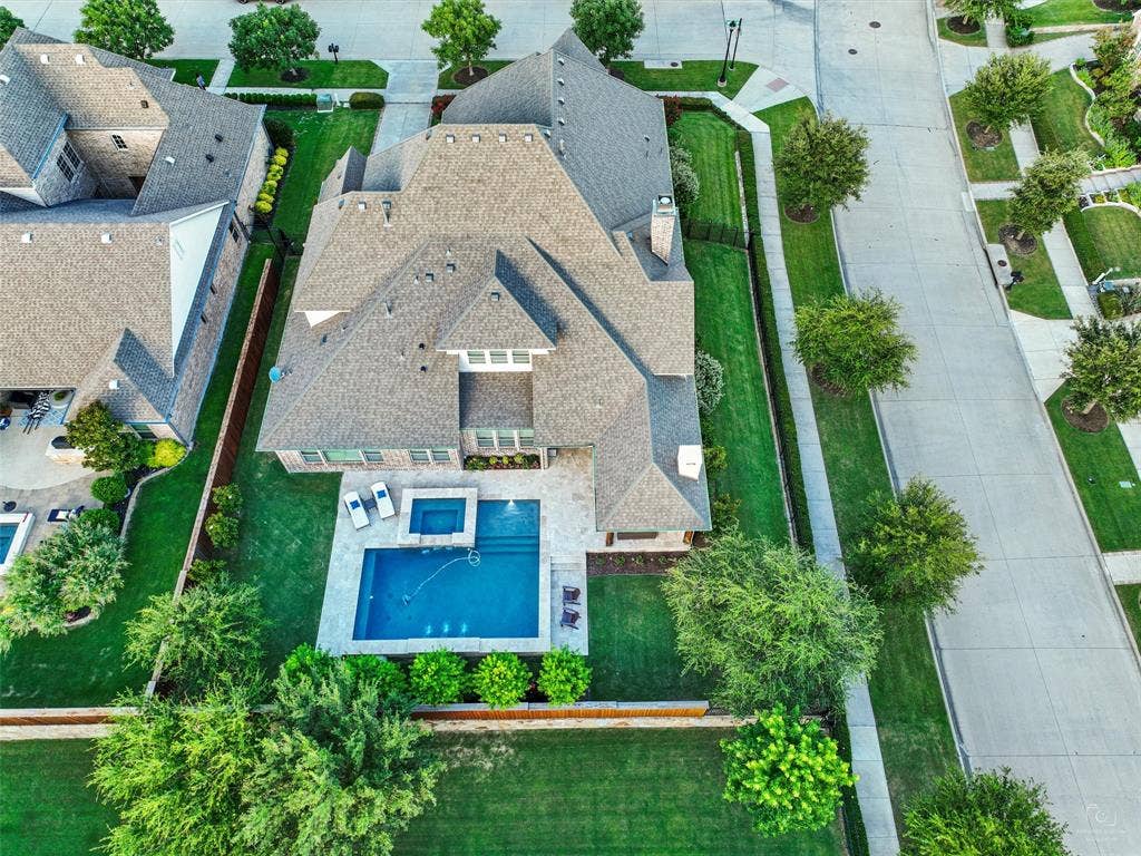 12921 Railhead Court, Frisco, TX 75033 Experience exceptional luxury, craftsmanship, and resort-style living in this beautifully appointed home in Newman Village. Thoughtfully designed for both sophisticated entertaining and comfortable everyday living, this residence combines impressive architectural details, rich hardwood flooring, custom finishes, expansive living spaces, and an extraordinary backyard retreat. Extensive recent improvements, including a new roof, upgraded home systems, and professionally designed outdoor amenities, further enhance this remarkable property. POOL - YARD - ALL HERE! HUGE OPEN YARD SPACES. GREAT for play, pets, and family entertaining.