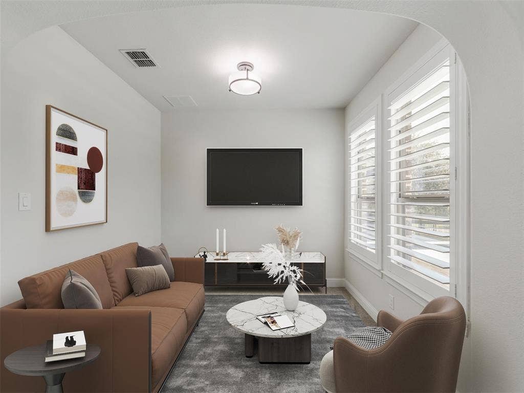 12921 Railhead Court, Frisco, TX 75033 The primary suite offers a spacious private retreat with an approximately 8-by-9-foot sitting area that can be used for reading, relaxing, or creating a quiet morning lounge. VIRTUALLY STAGED.