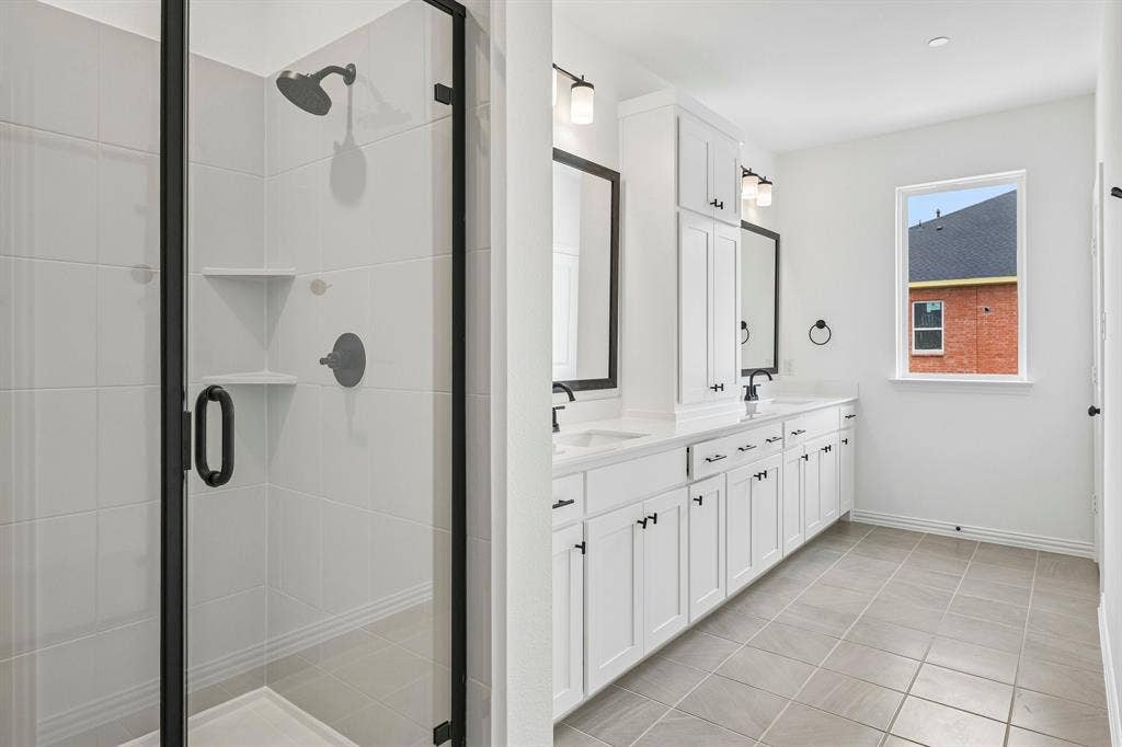 1374 Marsh Lane, Frisco, TX 75033 Featuring a spacious walk in shower, this owner's bath was designed with you in mind!
