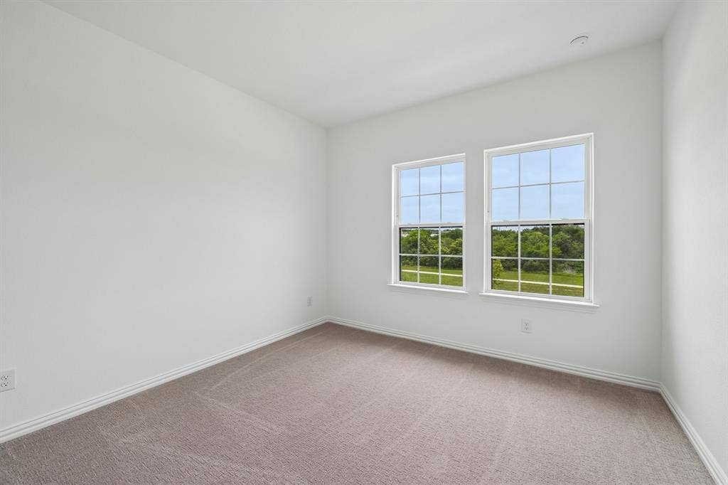 1374 Marsh Lane, Frisco, TX 75033 Guests will enjoy this nicely sized secondary bedroom.