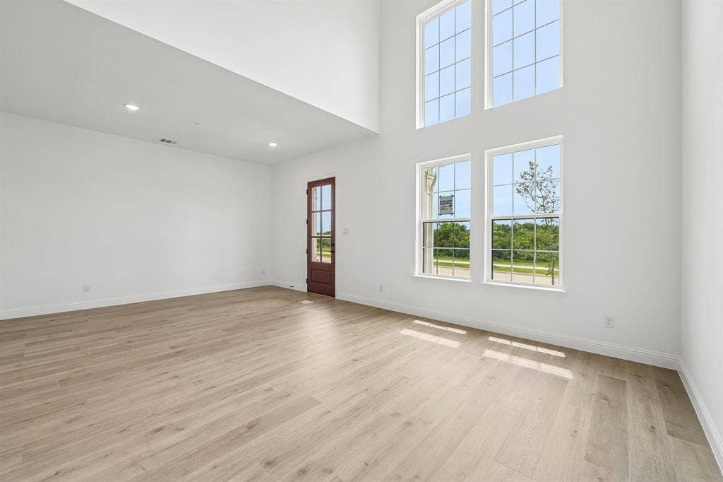 1374 Marsh Lane, Frisco, TX 75033 Featuring volume windows, this lovely home is flooded with natural light!