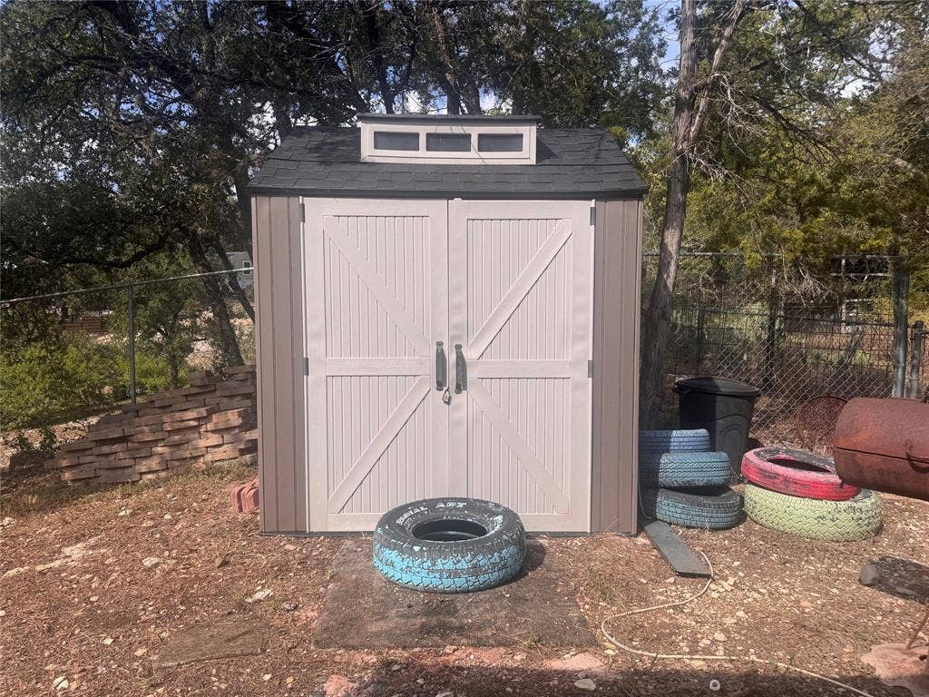 772 Rambling Drive, Canyon Lake, TX 78133 Storage shed that currently houses an outdoor kitchen.